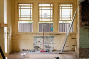 An apartment in the process of being renovated with the radiator removed.